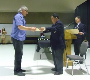 Sensei Receiving his Certificate